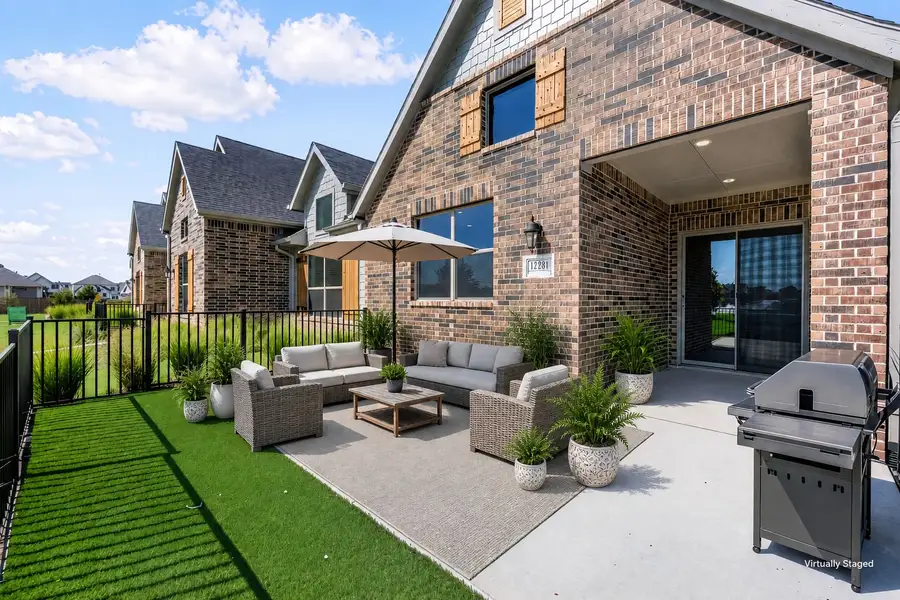 Exterior details and patio area of a home in Cottonwood Creek, Rowlett (Image 29).
