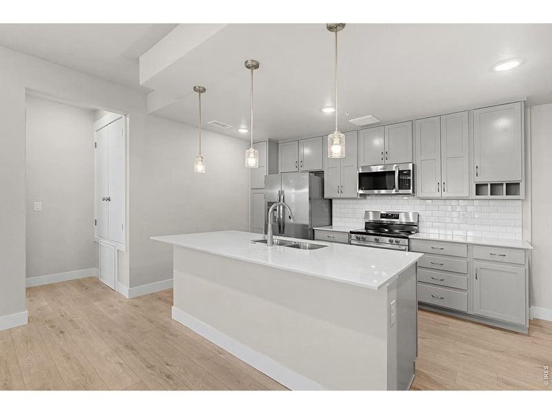Furnished interior view inside a new home in Highlands at Fox Hill - The Flats, Longmont (Image 7).