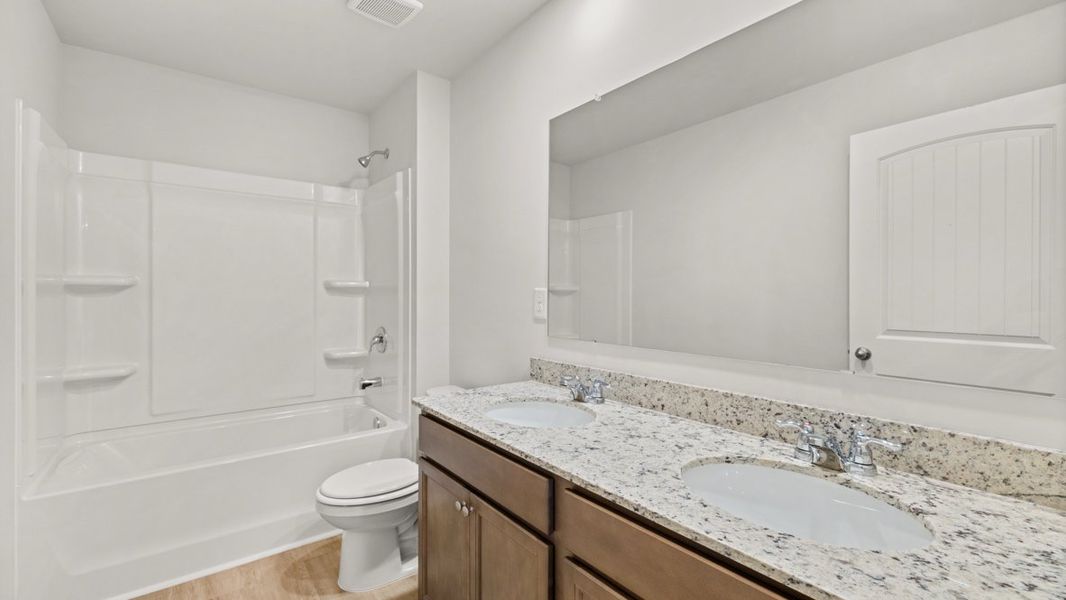 Furnished interior view inside a new home in Northwoods at Mirror Lake, Villa Rica (Image 9).