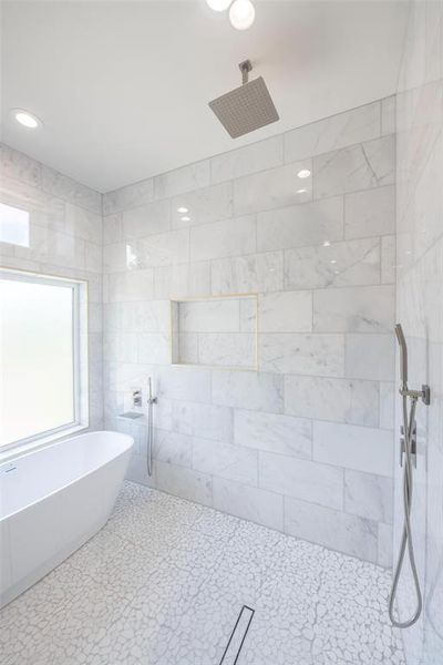 Bathroom with a tile shower and tile floors Bathroom with a tile shower and tile floors
