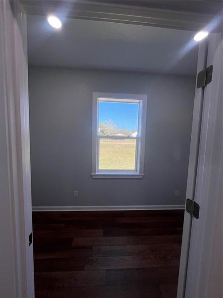 Spare room with dark wood finished floors and recessed lighting Spare room with dark wood finished floors and recessed lighting
