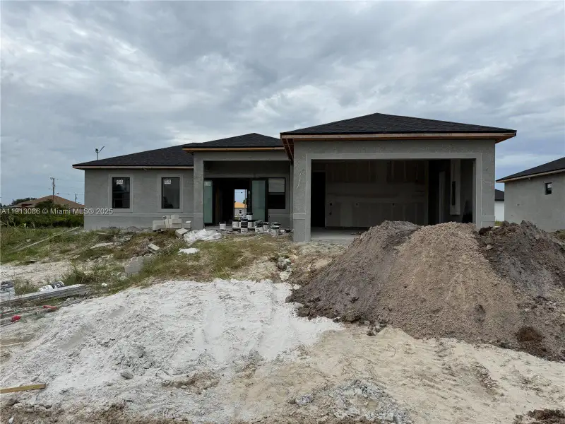 In-progress construction of a new home in , Lehigh Acres, FL (Image 1).