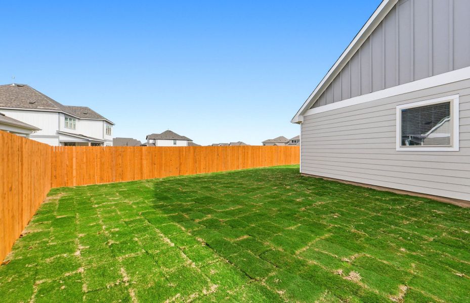 Exterior details and patio area of a home in Santa Rita Ranch, Liberty Hill (Image 29).