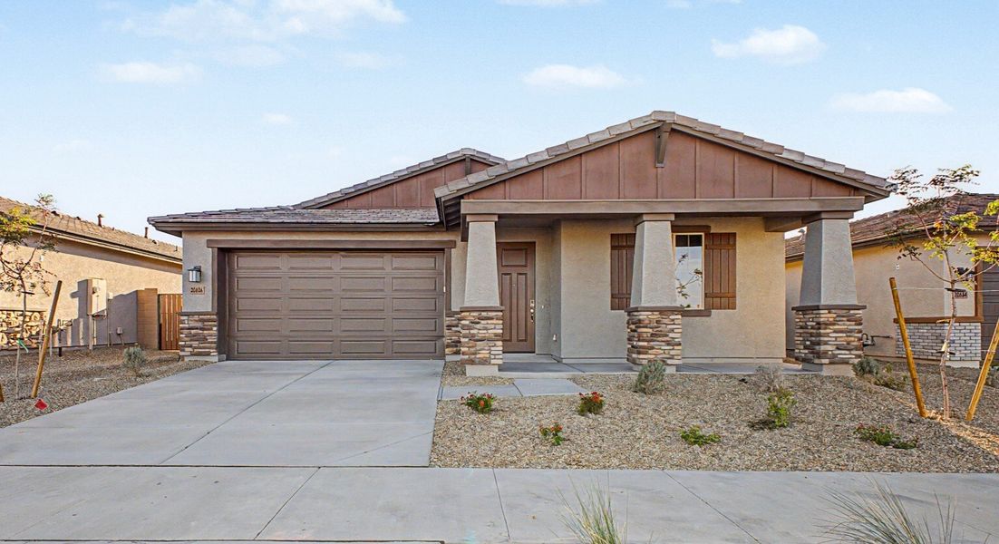 Front exterior of a new home in Frontera, Surprise, AZ, highlighting curb appeal (Image 1). Front exterior of a new home in Frontera, Surprise, AZ, highlighting curb appeal (Image 1).