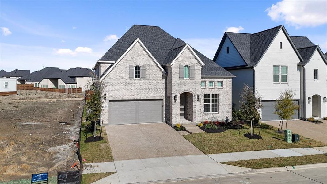 Front exterior of a new home in Brookhollow West, Prosper, TX, highlighting curb appeal (Image 23). Front exterior of a new home in Brookhollow West, Prosper, TX, highlighting curb appeal (Image 23).