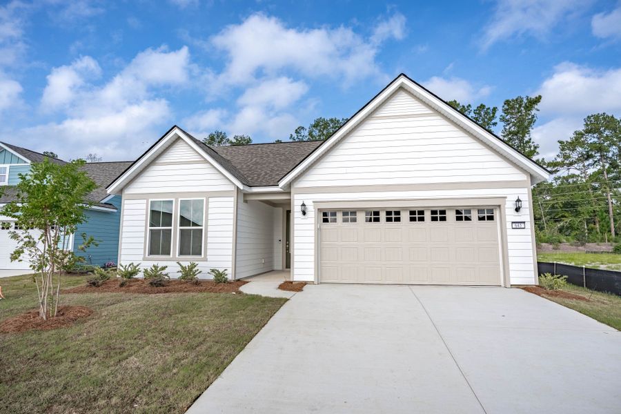 Front exterior of a new home in Del Webb Charleston at Nexton, Summerville, SC, highlighting curb appeal (Image 22). Front exterior of a new home in Del Webb Charleston at Nexton, Summerville, SC, highlighting curb appeal (Image 22).