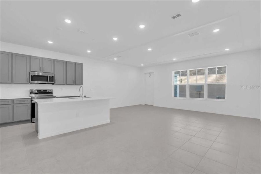 Furnished interior view inside a new home in The Residences at Emerson Park, Apopka (Image 7). Furnished interior view inside a new home in The Residences at Emerson Park, Apopka (Image 7).