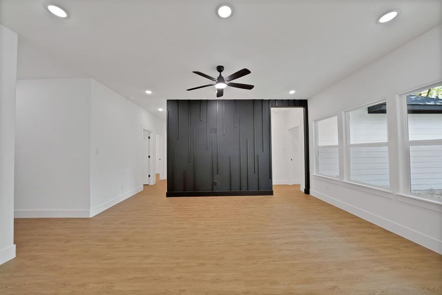 Unfurnished room with light wood-type flooring, recessed lighting, and ceiling fan