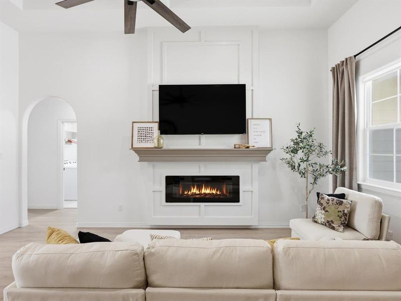 The beautiful trim work around this fireplace and mantle silently speak luxury.
