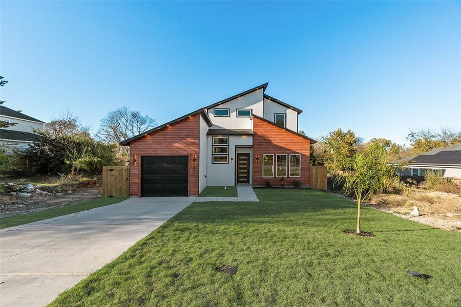 Contemporary house featuring concrete driveway Contemporary house featuring concrete driveway