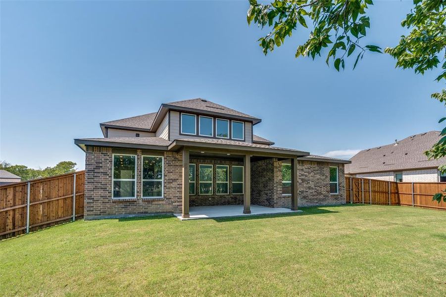 Front exterior of a new home in The Preserve Estates, Justin, TX, highlighting curb appeal (Image 18). Front exterior of a new home in The Preserve Estates, Justin, TX, highlighting curb appeal (Image 18).