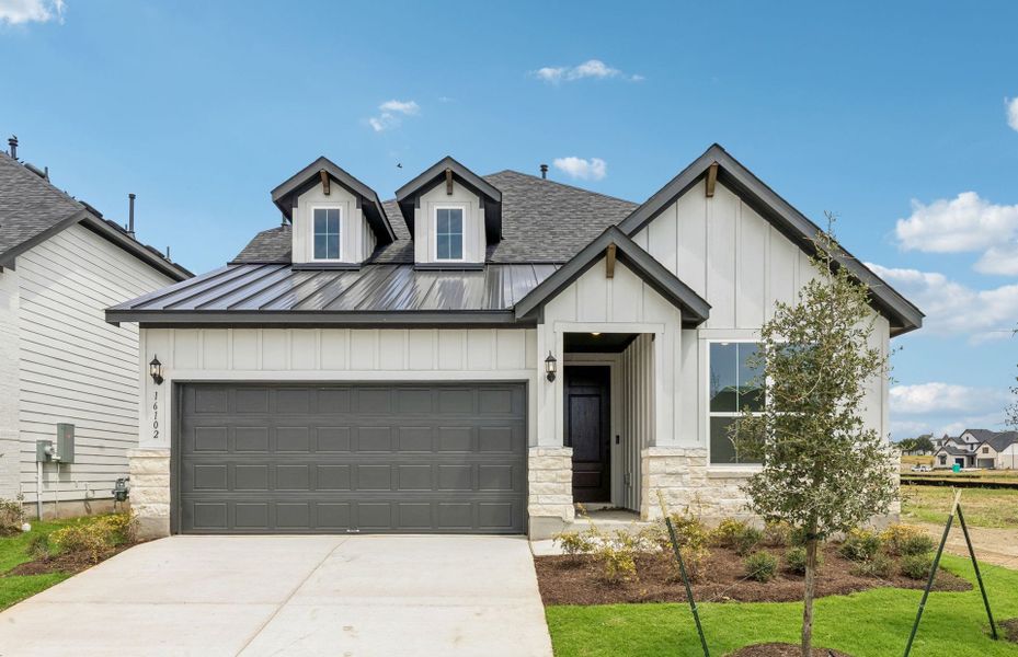 Front exterior of a new home in Kuempel Farms, Pflugerville, TX, highlighting curb appeal (Image 18). Front exterior of a new home in Kuempel Farms, Pflugerville, TX, highlighting curb appeal (Image 18).