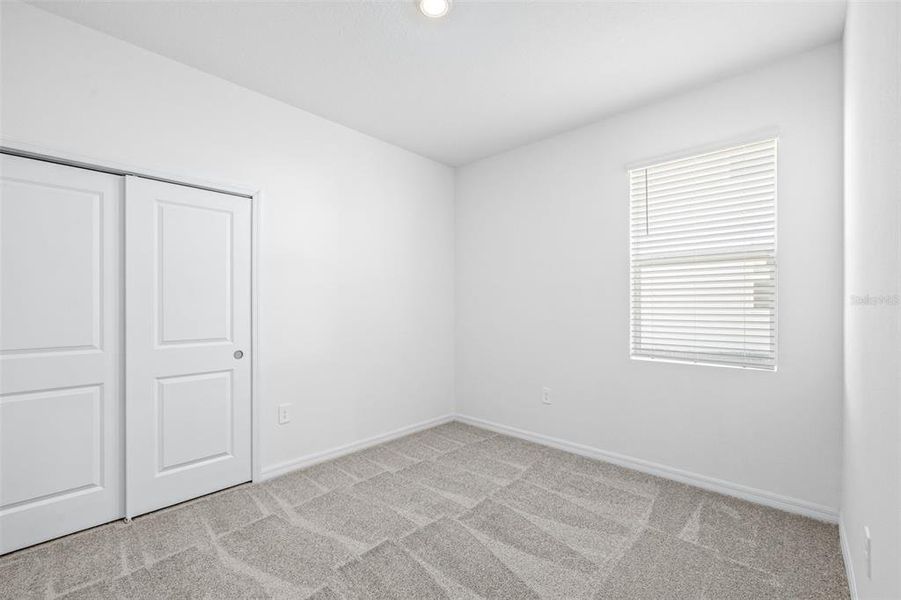 Spacious, unfurnished interior of a new home in The Grove at Stuart Crossing - Premier Series, Bartow (Image 36).