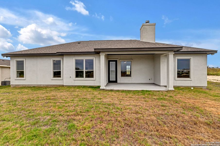 Front exterior of a new home in , La Vernia, TX, highlighting curb appeal (Image 25). Front exterior of a new home in , La Vernia, TX, highlighting curb appeal (Image 25).