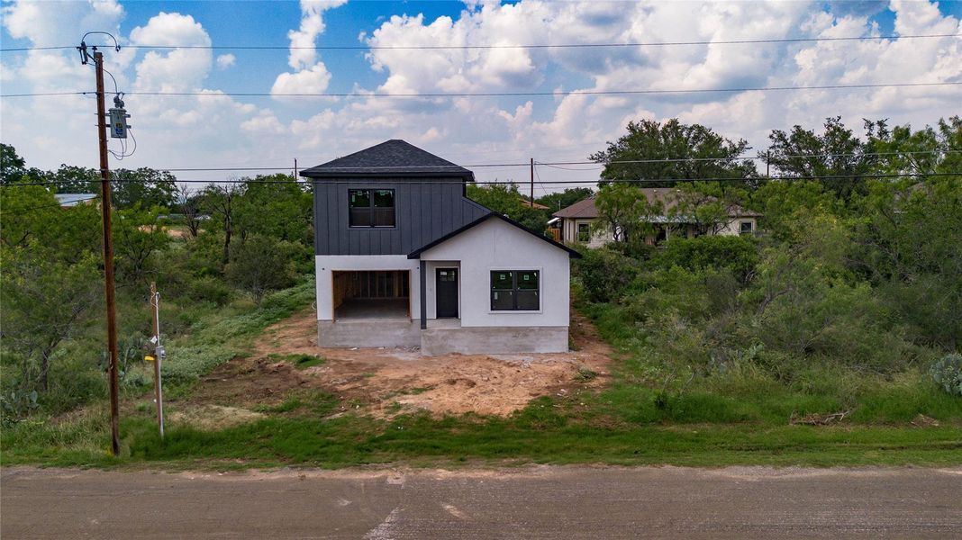 Front exterior of a new home in , Granite Shoals, TX, highlighting curb appeal (Image 1). Front exterior of a new home in , Granite Shoals, TX, highlighting curb appeal (Image 1).