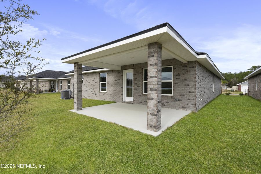 Exterior details and patio area of a home in Shadow Crest at Rolling Hills, Green Cove Springs (Image 2).