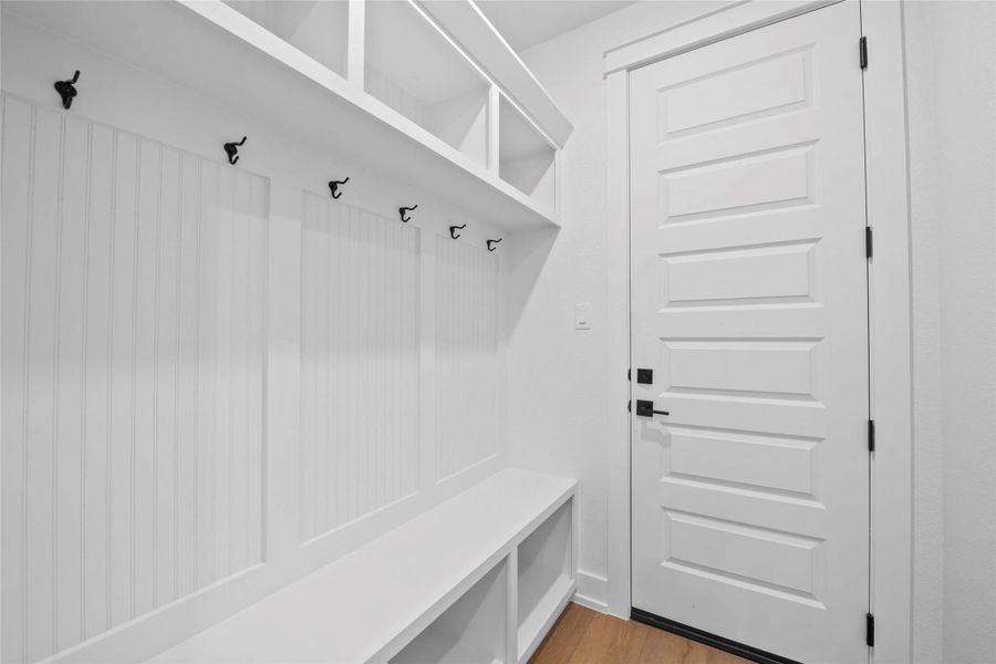 Mudroom with light wood-type flooring Mudroom with light wood-type flooring