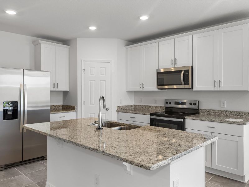 Kitchen in the Daphne floorplan at 3555 Broadwing Boulevard