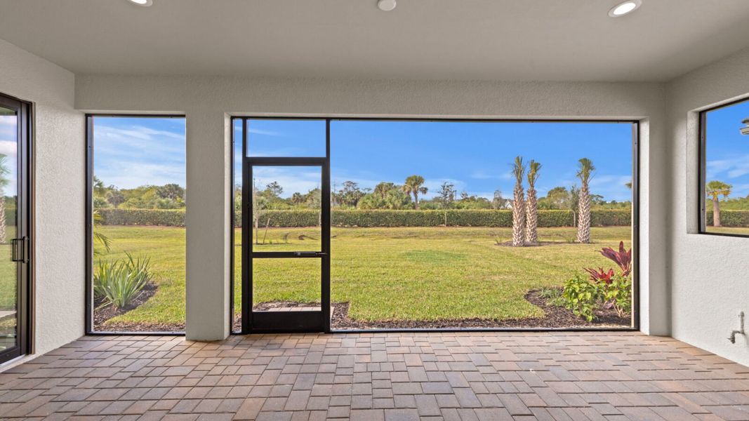 Exterior details and patio area of a home in SkySail, Naples (Image 25).