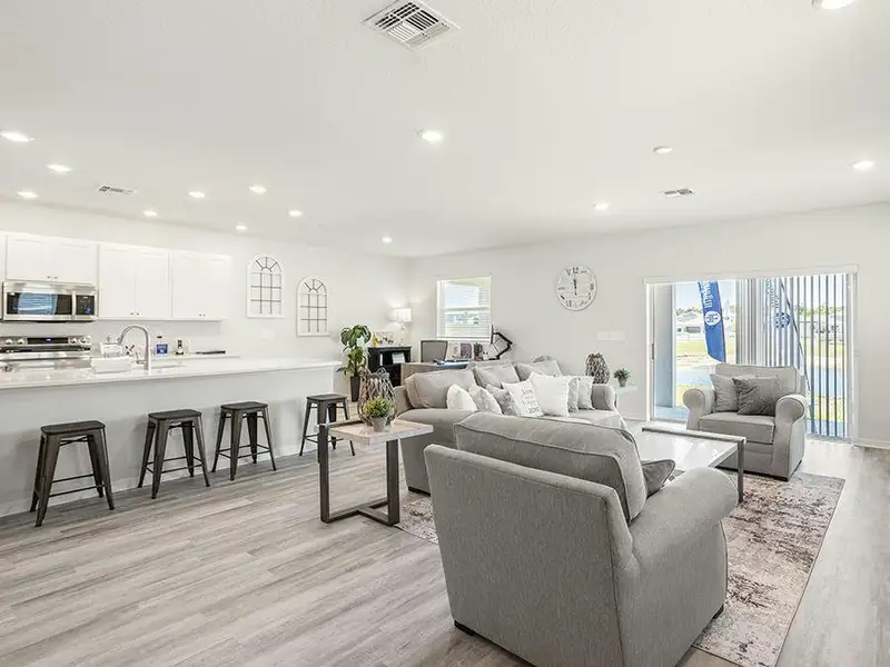 The living space is filled with natural light - Wesley II by Highland Homes