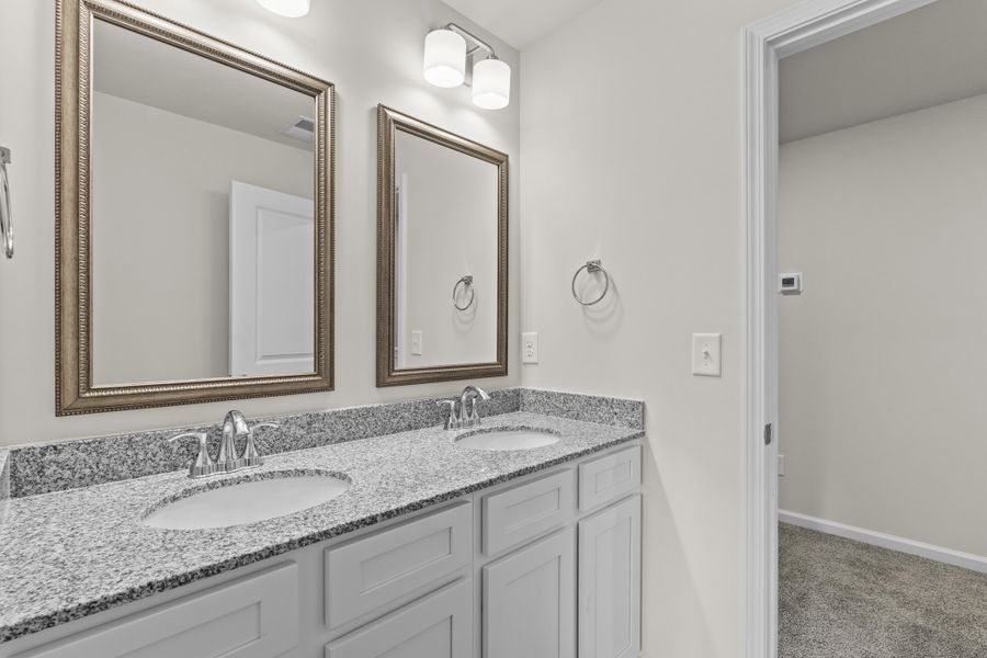 Representative furnished interior of a home built from the Cedar A by McGuinn Homes in Forts Ridge, Pelion (Image 10).