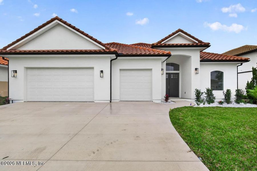 Front exterior of a new home in , St. Johns, FL, highlighting curb appeal (Image 37).