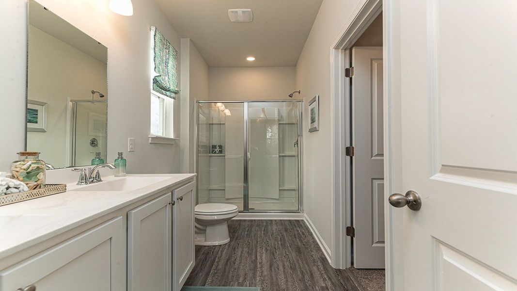 Furnished interior view inside a new home in Stanbury Creek, Supply (Image 12).