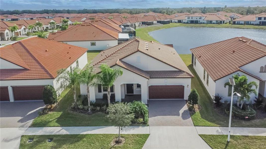 Front exterior of a new home in Southshore Bay: The Estates, Wimauma, FL, highlighting curb appeal (Image 28).
