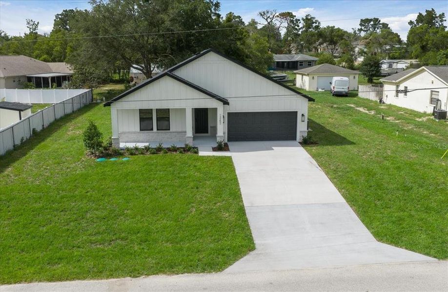 Front exterior of a new home in , Spring Hill, FL, highlighting curb appeal (Image 27).