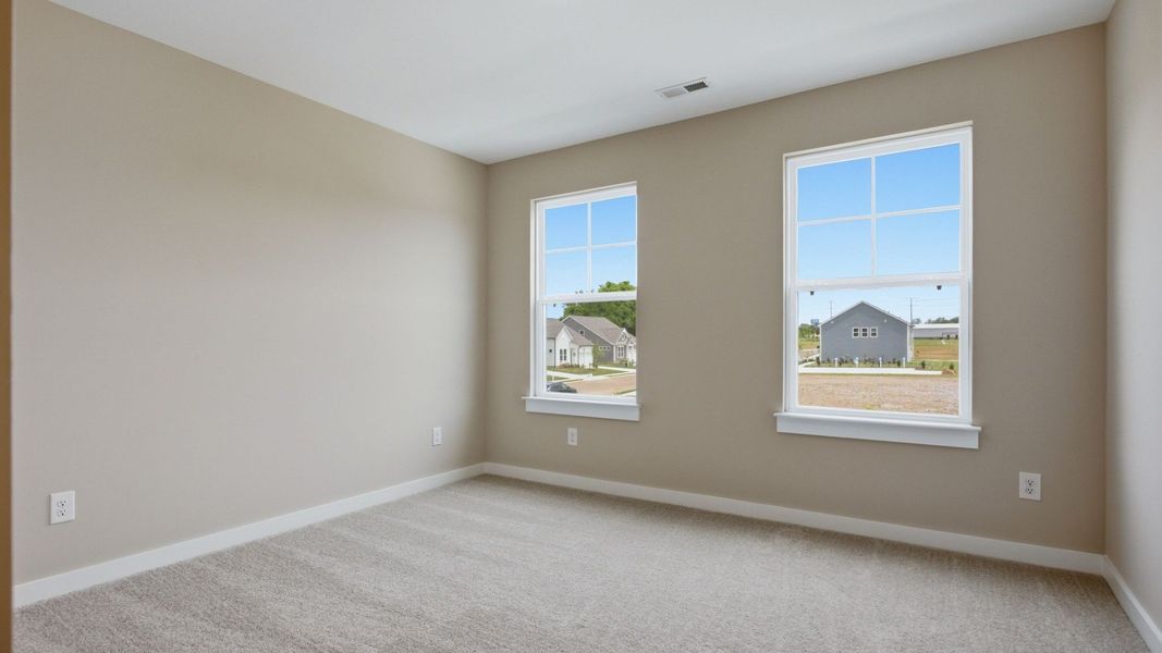Bedroom with carpet and windows Bedroom with carpet and windows