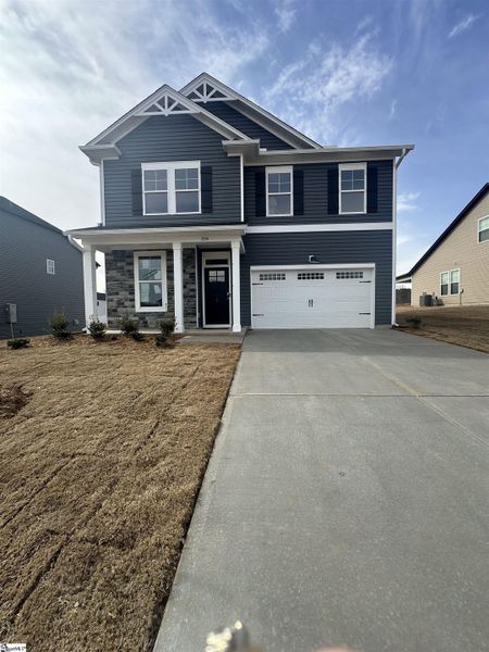 Front exterior of a new home in Shiloh Trail, Wellford, SC, highlighting curb appeal (Image 21). Front exterior of a new home in Shiloh Trail, Wellford, SC, highlighting curb appeal (Image 21).