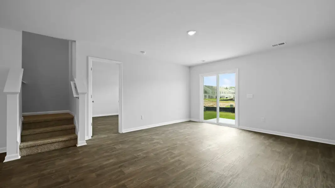 Spacious, unfurnished interior of a new home in Pine Hills Townhomes at Cane Bay, Summerville (Image 13). Spacious, unfurnished interior of a new home in Pine Hills Townhomes at Cane Bay, Summerville (Image 13).