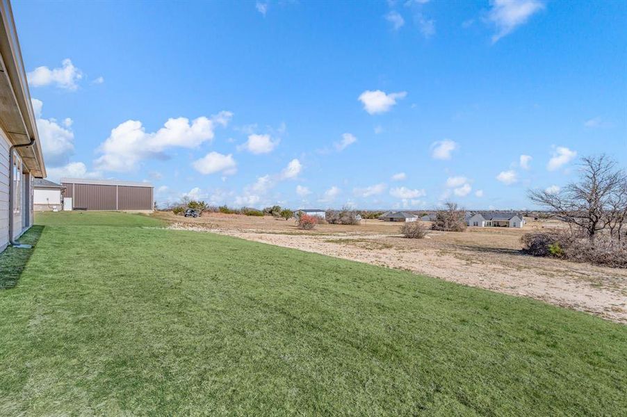 Exterior details and patio area of a home in Gatlin Ranch, Springtown (Image 24).