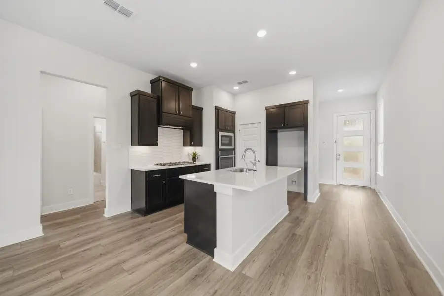 Open concept design seamlessly connects the living, dining, and kitchen spaces. Open concept design seamlessly connects the living, dining, and kitchen spaces.