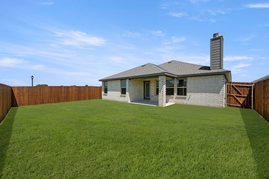 Representative exterior photo of a completed home built from the Austin by Impression Homes in Baker Farms, Cleburne, TX (Image 23).
