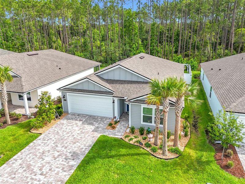 Front exterior of a new home in Sawmill Branch Express, Palm Coast, FL, highlighting curb appeal (Image 2).