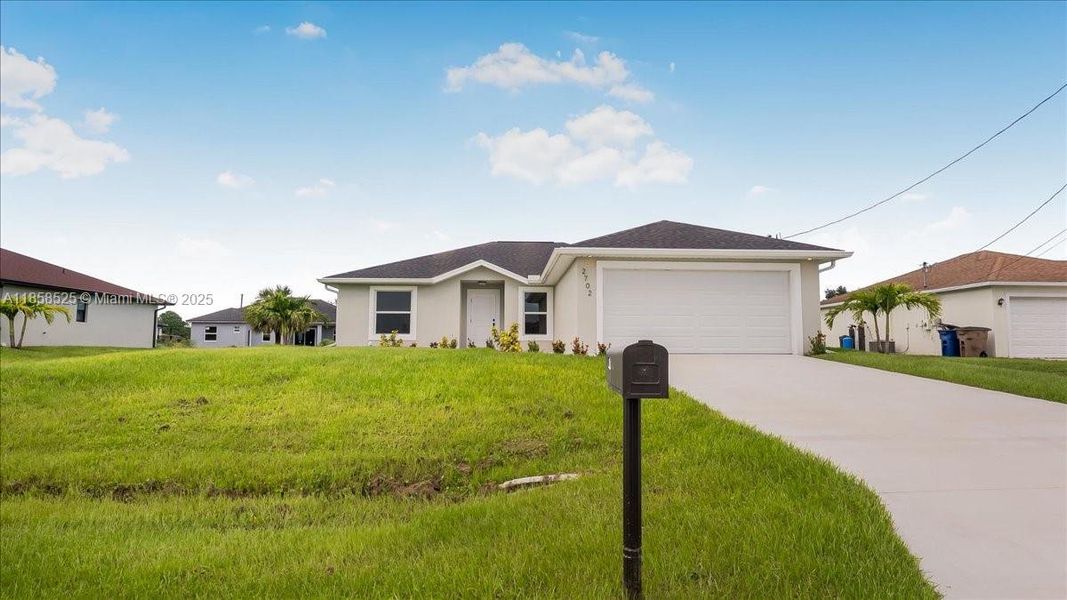 Front exterior of a new home in , Lehigh Acres, FL, highlighting curb appeal (Image 14).