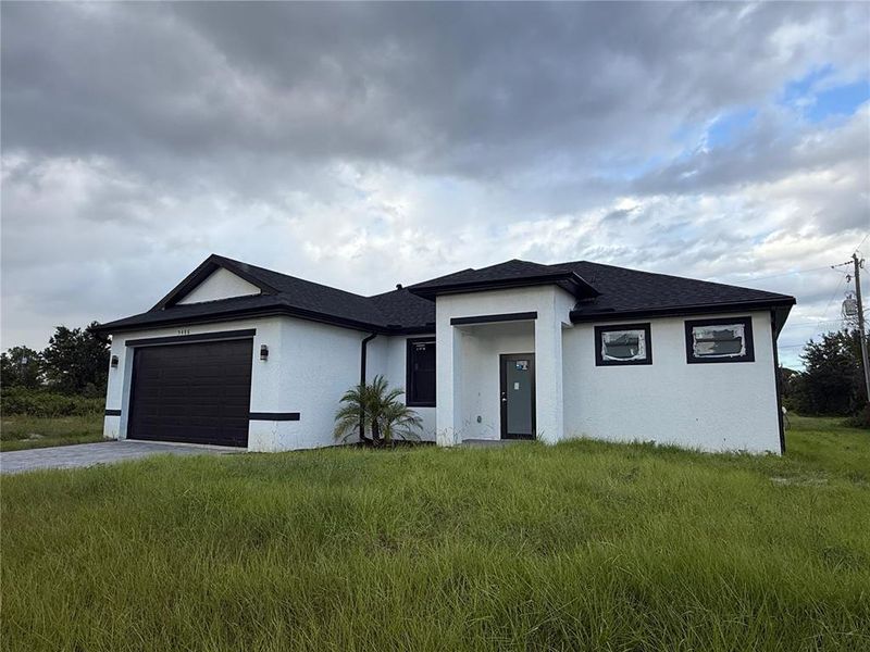 Front exterior of a new home in , Port Charlotte, FL, highlighting curb appeal (Image 2).