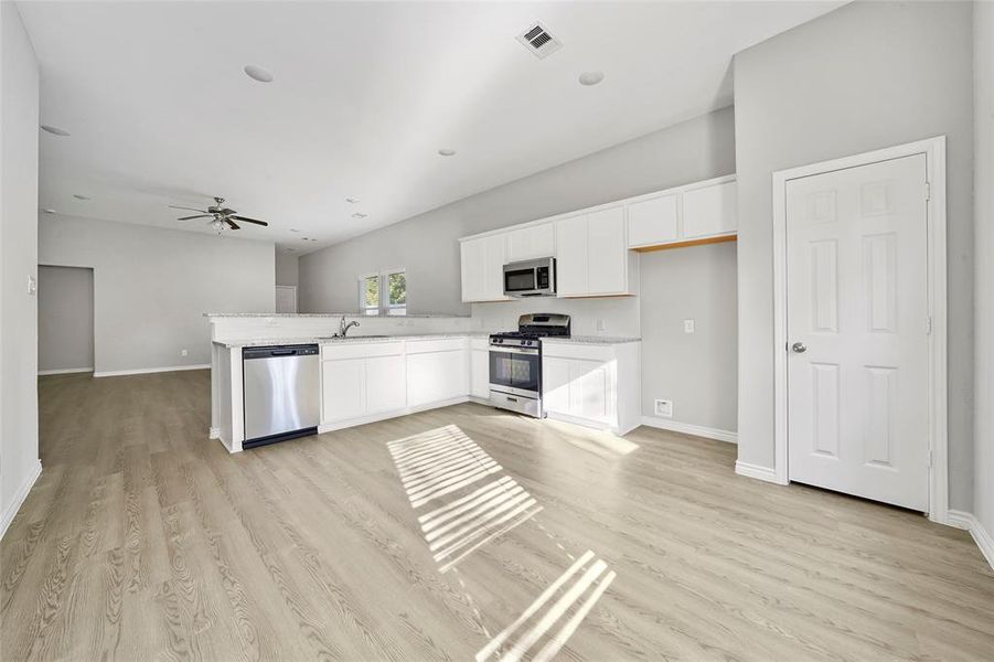 Kitchen with granite counters, ample storage and counter space