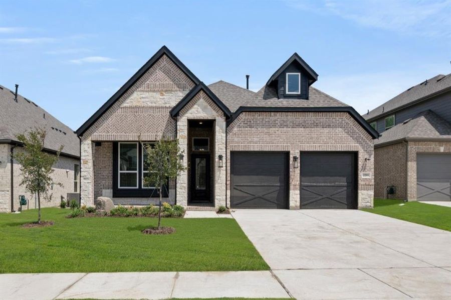 Front exterior of a new home in Birdsong, Mansfield, TX, highlighting curb appeal (Image 2). Front exterior of a new home in Birdsong, Mansfield, TX, highlighting curb appeal (Image 2).