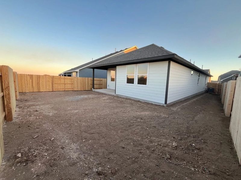 Exterior details and patio area of a home in Lariat, Liberty Hill (Image 9).