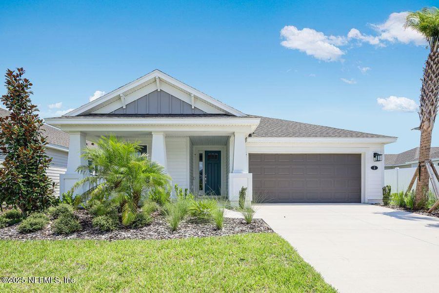 Front exterior of a new home in Colbert Landings, Palm Coast, FL, highlighting curb appeal (Image 17).