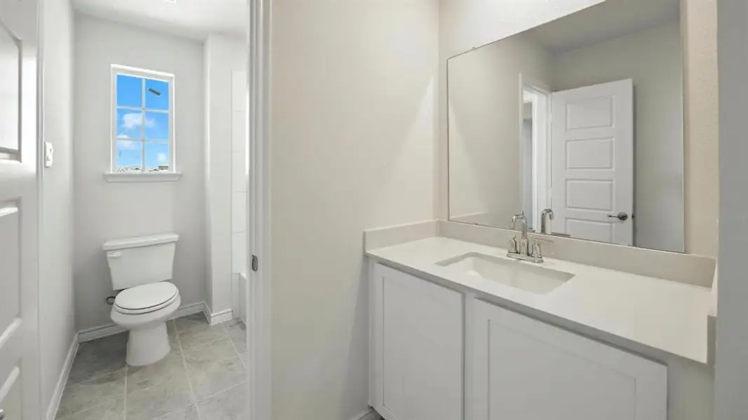 Bathroom featuring vanity and light tile patterned floors