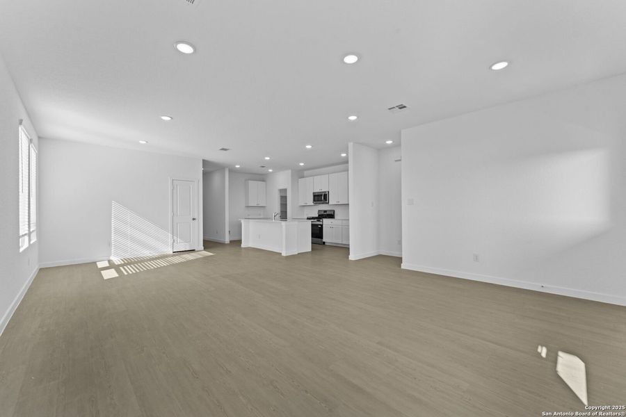 Spacious, unfurnished interior of a new home in Waterwheel: Coastline Collection, San Antonio (Image 14).