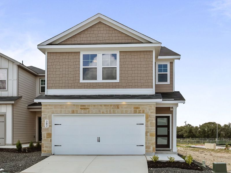 Front exterior of a new home in Meadows at Oak Creek, San Antonio, TX, highlighting curb appeal (Image 17).