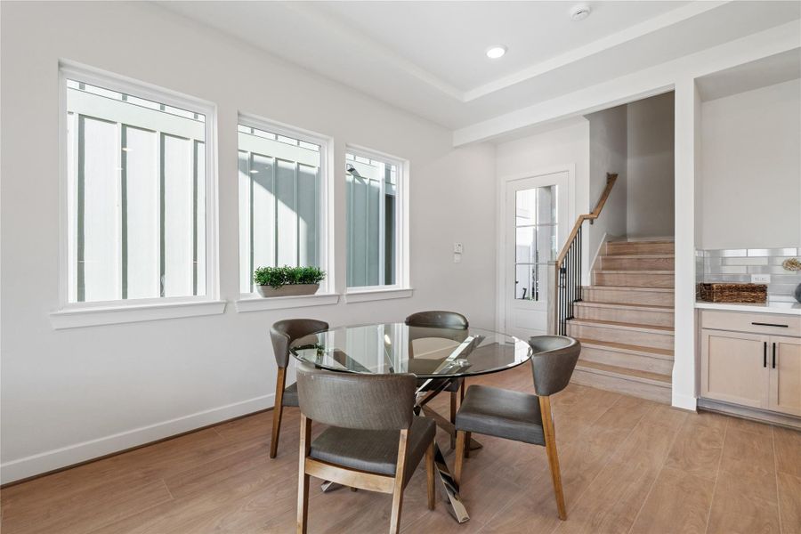 A row of multi-pane windows along the dining area brings in steady natural light and keeps the space feeling open through the day. A row of multi-pane windows along the dining area brings in steady natural light and keeps the space feeling open through the day.