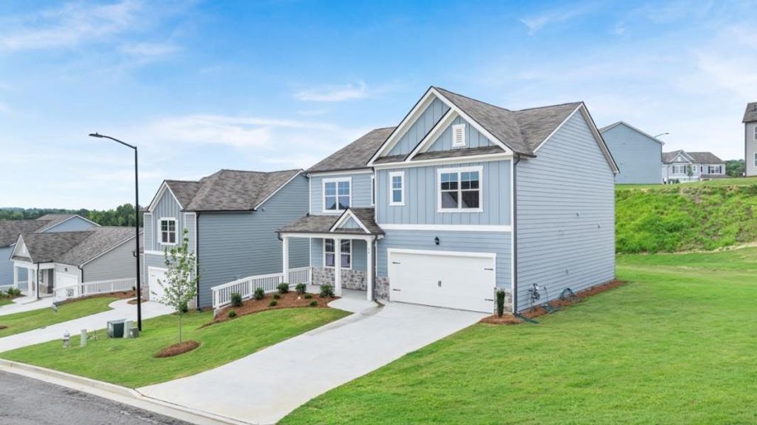 Front exterior of a new home in Sheffield Highlands, Dallas, GA, highlighting curb appeal (Image 18).