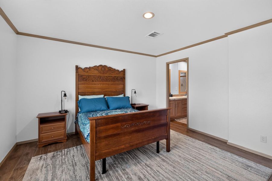 Comfortable bedroom retreat with a private en-suite bathroom.