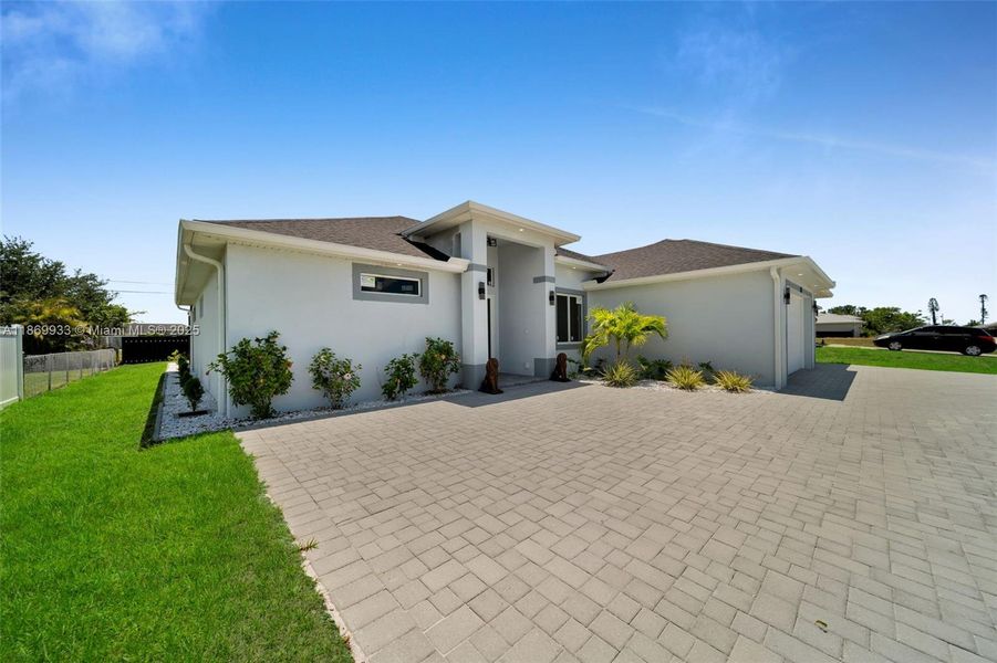 Front exterior of a new home in , Cape Coral, FL, highlighting curb appeal (Image 26).