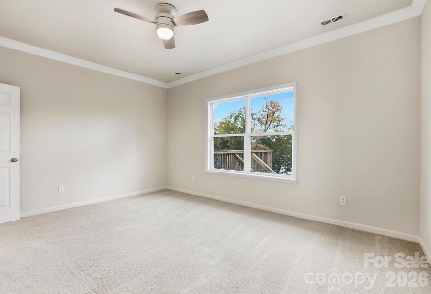 Main Level Primary Suite, where you wake up to direct lake views